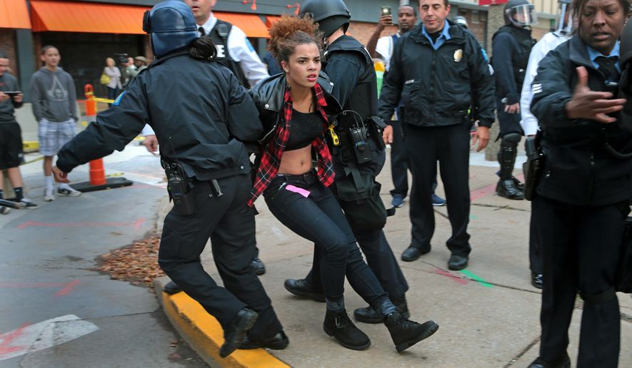 Police arrest a protster